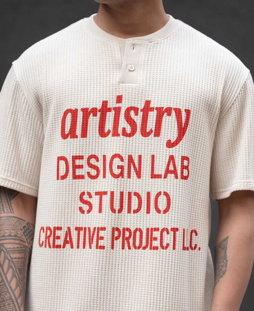Cream Structured Printed Regular Fit Half Sleeves T-Shirt.